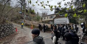 The location where Yuki Adachi's backpack was left, as reported by Bunshun, is near the storage shed behind his house.
